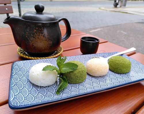 Matcha mochi served with tea at Fifth Avenue Sushi